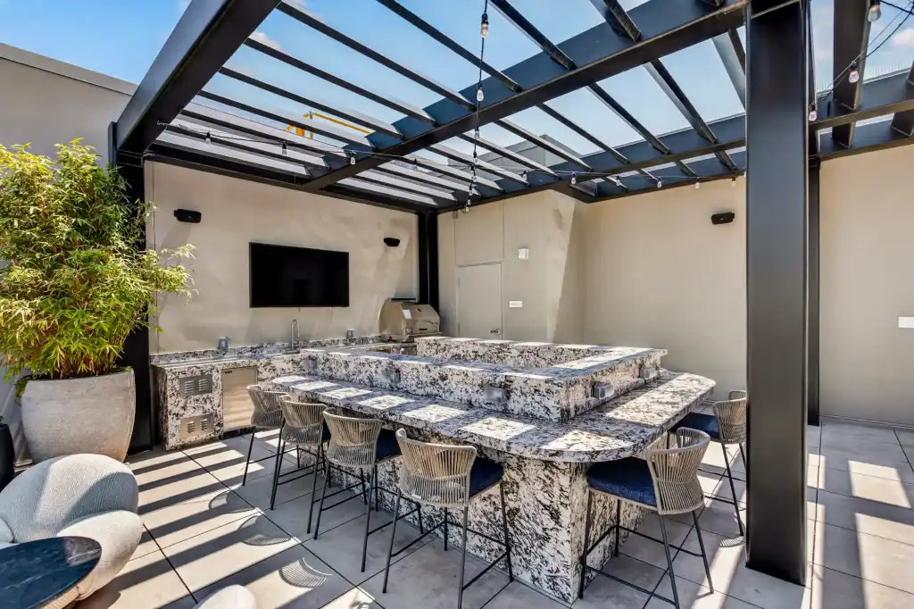 Modern rooftop lounge with outdoor bar and seating area at 5420 Sunset.